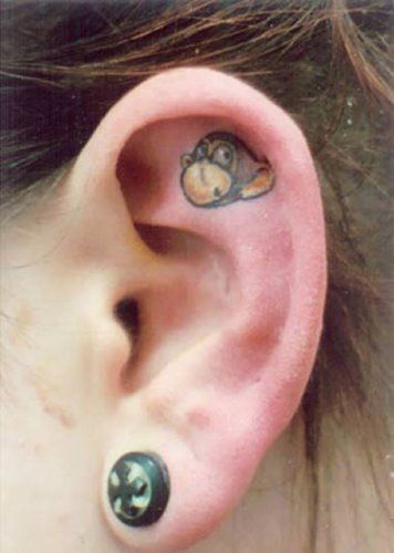 Татуировки на ушах (12 фото)
