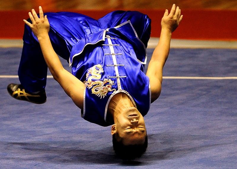 Бин Вэй-чуа из Тайваня на соревнованиях по ушу на Всемирных играх в г. Гаосюн 24 июля. (SAM YEH/AFP/Getty Images)